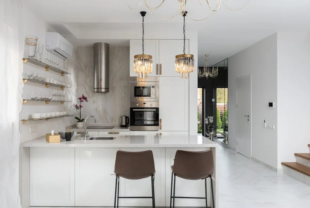 Modern kitchen with marble floors and elegant lighting