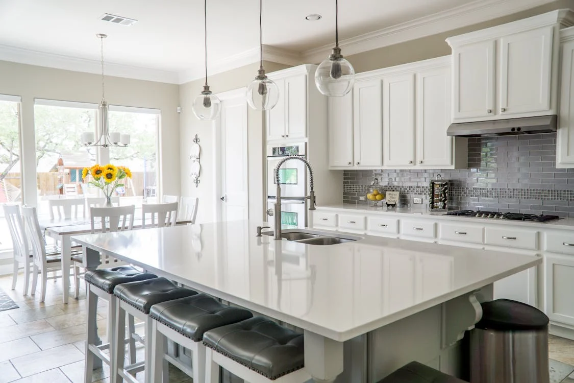 Modern kitchen with white cabinets and central island