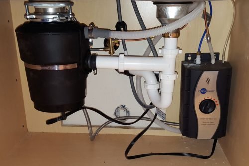 Under-sink garbage disposal and water filtration system installation