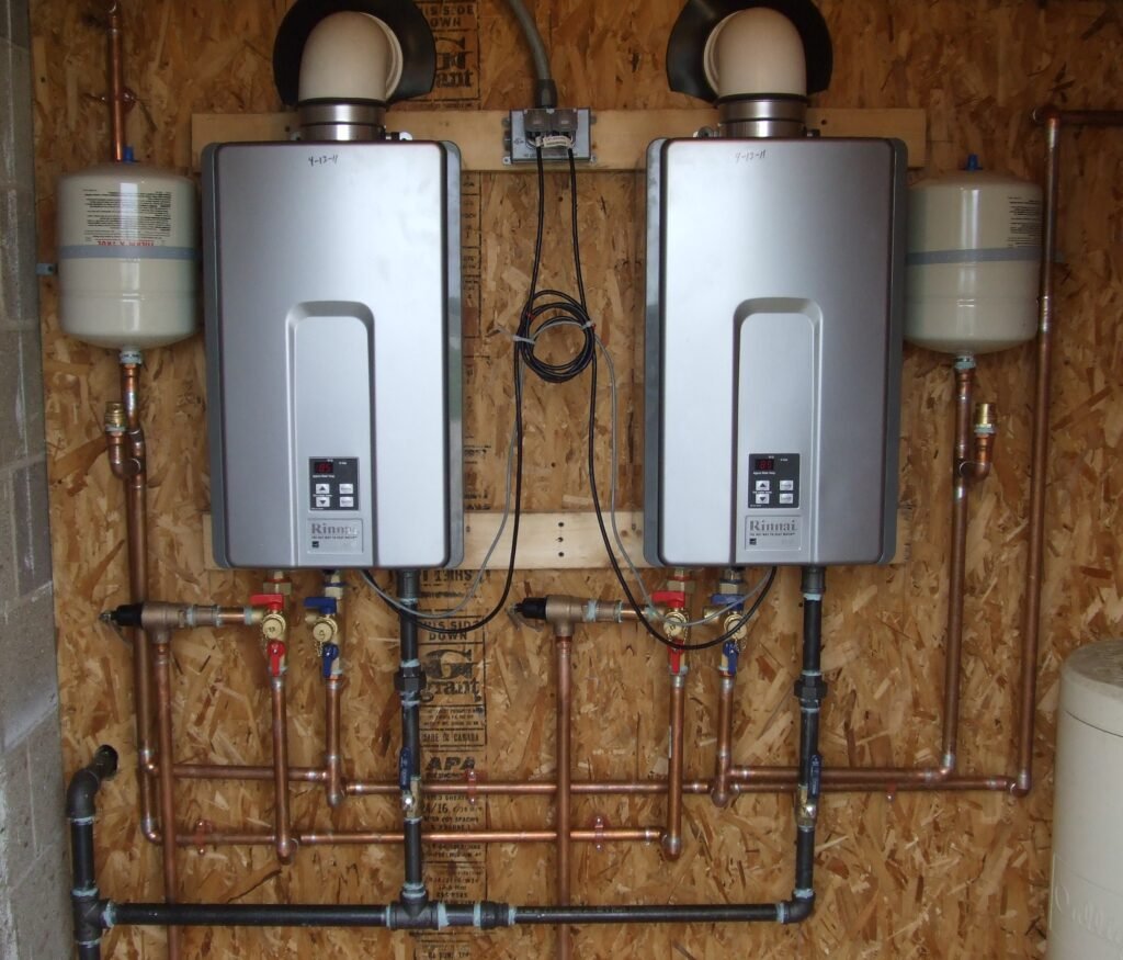 Dual tankless water heaters installation on wooden wall