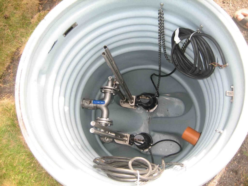 Industrial equipment inside large round metal container