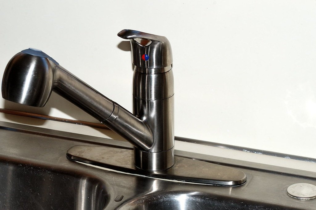 Stainless steel kitchen faucet on sink