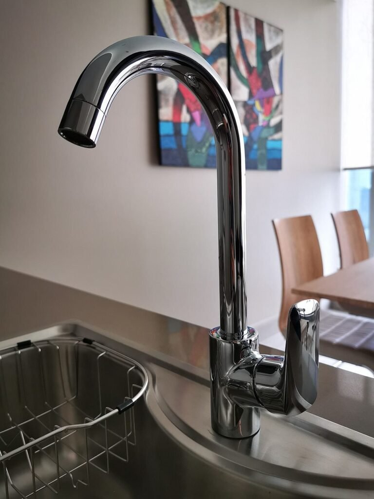 Modern kitchen faucet over stainless steel sink